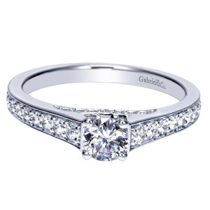 Gabriel & Co. ER98626W44JJ 14 karat white gold Contemporary engagement ring, front view of the round center raised above wide shoulders of bead set stones