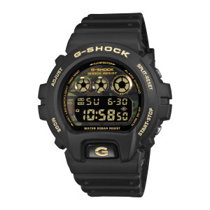 Casio G-Shock DW6900CF-1 watch, front view of the black case with gold tone words around the bezel and a camouflage strip