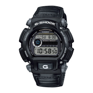 Casio G-Shock DW9052V-1 watch, front view of a black case with gray corner buttons, a silver ringed dial and a cloth strap