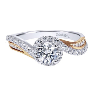 Gabriel & Co. ER11834R2T44JJ two-tone 14 karat gold Contemporary engagement ring, angled view of the round center ringed by a single halo where two pave arms cross
