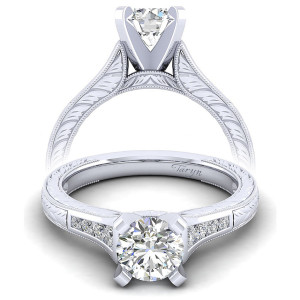 Taryn TE10276W44JJ 14 karat white gold engagement ring, front view of a round center flanked by channel set rows on a hand engraved shank