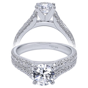 Taryn TE10283W44JJ 14 karat white gold engagement ring, front view of a round center above twin pave rows split by a milgrain ridge