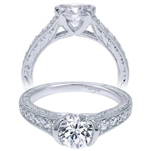 Taryn TE10294W44JJ 14 karat white gold engagement ring, front view of a round center clasped by curved side rails above bead set engraved shoulders