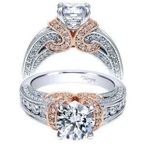 Taryn TE11835R4T44JJ 14 karat white gold engagement ring, front view of a round center wrapped by a scrolled pave collar above a channel set shank