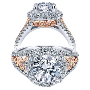Taryn TE11980R6T83JJ 18 karat white and rose gold engagement ring, front view of a round center in a large round halo above shoulders with filigree scroll panels