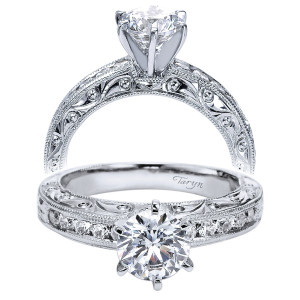 Taryn TE4178W44JJ 14 karat white gold engagement ring, front and rear views of a round center above a channel set row and pierced scroll shoulders