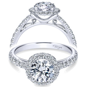 Taryn TE7261W44JJ 14 karat white gold engagement ring, front view of a round center in a single halo over a scrolled filigree gallery and pave shank