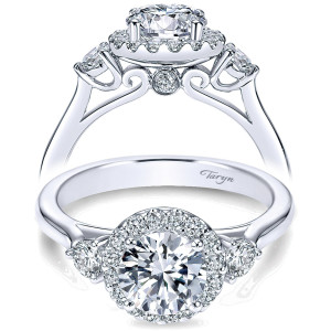 Taryn TE7482W44JJ 14 karat white gold engagement ring, front view of a halo framed round center between two round stones above a plain polished shank