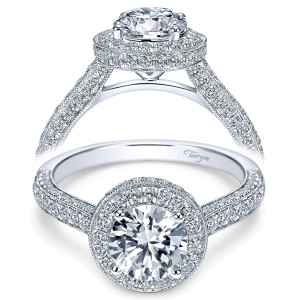 Taryn TE7489W44JJ 14 karat white gold engagement ring, front view of a round center in a domed milgrain halo above pave covered tapering shoulders