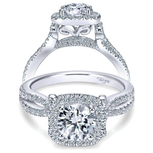 Taryn TE7806W44JJ 14 karat white gold engagement ring, front view of a round center under a squared halo, filigree scrolls beneath and twisted pave shoulders