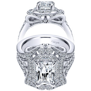 Taryn TE8940W83JJ 18 karat white gold engagement ring, front and side views of an elongated center in a double halo above a bow shaped gallery
