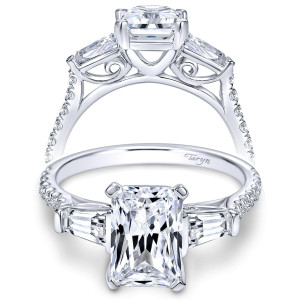 Taryn TE9047W44JJ 14 karat white gold engagement ring, front view of the center stone flanked by tapered baguettes with scrolled filigree beneath the setting