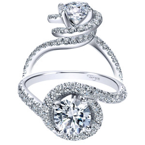 Taryn TE9053W44JJ 14 karat white gold engagement ring, front view of a round center wrapped by a spiraling pave ribbon that becomes the shank