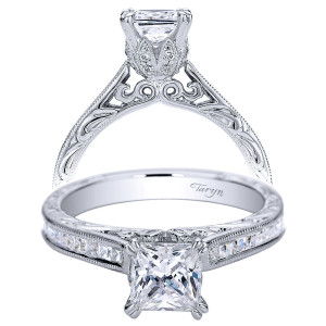 Taryn TE9198W44JJ 14 karat white gold engagement ring, front view of a princess center above channel set squares with filigree scrollwork gallery and milgrain edges