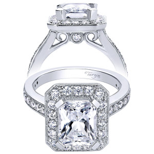 Taryn TE9336W44JJ 14 karat white gold engagement ring, front view of a rectangular center inside a halo of graduated rounds above a bezel accented gallery