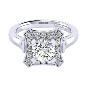 Gabriel & Co. ER009C6AEW44JJ 14 karat white gold Perfect Match engagement ring, top view of the round center framed by a pointed star shaped milgrain plate