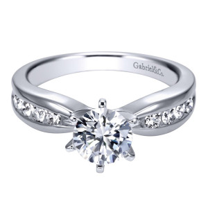 Gabriel & Co. ER1726PT3JJ platinum Contemporary engagement ring, front view of the round center in six prongs above a channel row crossing each shoulder