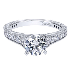Gabriel & Co. ER10274W44JJ 14 karat white gold Victorian engagement ring, front view of the round center above graduated rounds framed by milgrain and pierced side holes