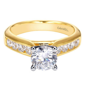 Gabriel & Co. ER3962M44JJ two-tone 14 karat gold Contemporary engagement ring, front view of a round center in rounded tip prongs above a wide channel row