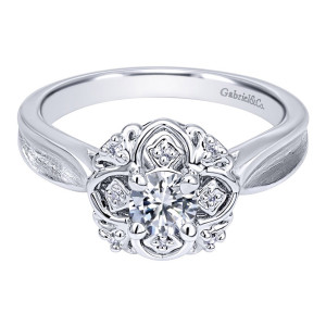 Gabriel & Co. ER910091W44JJ 14 karat white gold Contemporary engagement ring, top view of the round center held by scrolled petals with tiny stones between them
