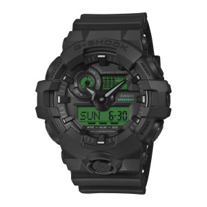 Casio G-Shock GA700BEG-1A watch, front view of a squared black case with a wide green digital panel and a knurled bottom button