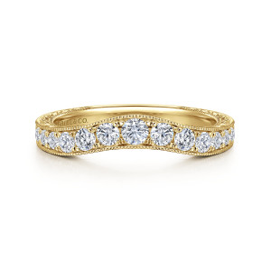 Gabriel & Co. AN10961Y44JJ 14 karat yellow gold Contemporary band, front view of a gently arched band with round stones tapering toward each end