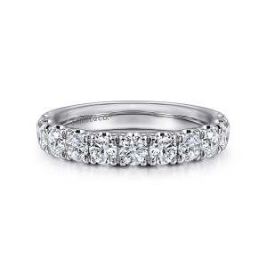 Gabriel & Co. AN11179W44JJ 14 karat white gold Classic wedding band, front view of the straight band with round diamonds between shared prongs and a maker's mark inside