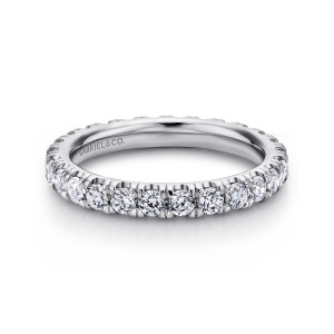 Gabriel & Co. AN11262-4W44JJ 14 karat white gold Classic eternity band, top view of the round stones lined up along the front with prongs rising between them