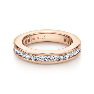 Gabriel & Co. AN11292-4K44JJ 14 karat rose gold Contemporary eternity band, angled view of round stones sunk between two polished rails with slots inside the hoop