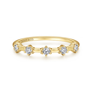 Gabriel & Co. AN15099Y44JJ 14 karat yellow gold Starlight anniversary band, front view of spaced round diamonds joined by short smooth bars of metal