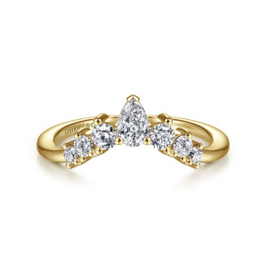 Gabriel & Co. AN15303Y44JJ 14 karat yellow gold Starlight anniversary band, front view of a crown shaped curve with a pear shaped stone above smaller round stones