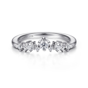Gabriel & Co. AN15305W44JJ 14 karat white gold Starlight anniversary band, front view of the peaked top with a larger crest stone and a maker's mark inside