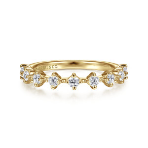 Gabriel & Co. AN15313Y44JJ 14 karat yellow gold Starlight anniversary band, front view of evenly spaced round stones in separate heads joined by small beaded bars