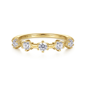 Gabriel & Co. AN15377Y44JJ 14 karat yellow gold Starlight anniversary band, front view of round stones in prong heads with short smooth bars between them
