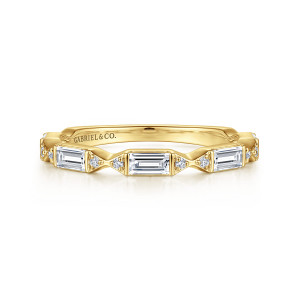 Gabriel & Co. AN15555Y44JJ 14 karat yellow gold Art Deco anniversary band, front view of long baguette diamonds divided by small round diamonds at pinched points