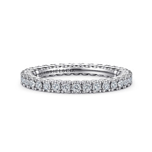 Gabriel & Co. AN15582-4W44JJ 14 karat white gold Classic eternity band, front view of round diamonds in tidy prongs with a maker's mark inside the hoop