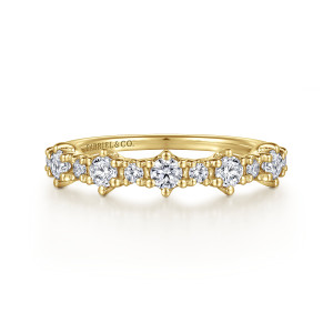 Gabriel & Co. AN15583Y44JJ 14 karat yellow gold Starlight anniversary band, front view of larger round stones in raised heads with small beaded stones between them