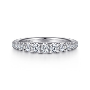 Gabriel & Co. AN15584W44JJ 14 karat white gold Classic wedding band, front view of a row of round diamonds largest at the middle with prongs between neighbors