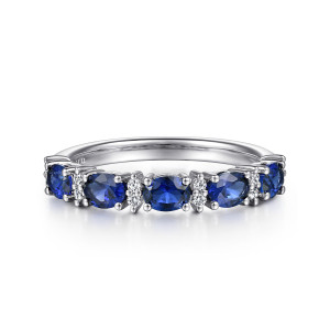 Gabriel & Co. AN15827W44SA 14 karat white gold Contemporary anniversary band, front view of the band with deep blue stones alternating with pairs of tiny diamonds