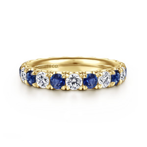 Gabriel & Co. AN15890-6Y44SA 14 karat yellow gold Classic eternity band, front view of alternating blue and colorless round stones held in shared prongs