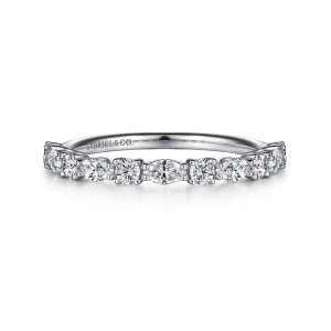 Gabriel & Co. AN15974W44JJ 14 karat white gold Classic anniversary band, front view of round diamonds alternating with sideways elongated stones along the top