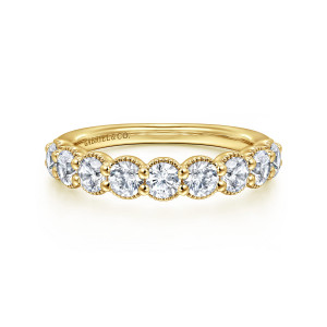 Gabriel & Co. AN16332Y44JJ 14 karat yellow gold Victorian anniversary band, front view of round diamonds in beaded collars running along the top of the band