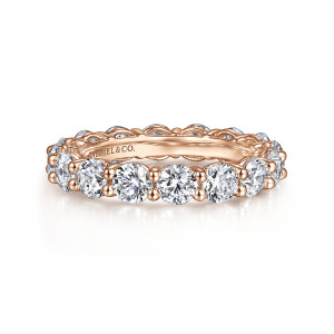 Gabriel & Co. AN16388-6K44JJ 14 karat rose gold Classic eternity band, front view of round stones sitting apart, each gap holding a pair of small round tipped prongs