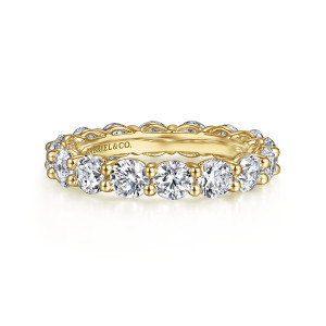 Gabriel & Co. AN16388-6Y44JJ 14 karat yellow gold Classic eternity band, front view of round stones between ball tipped prongs, with a maker's mark inside the band