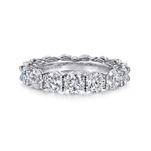 Gabriel & Co. AN16389-6W44JJ 14 karat white gold Classic eternity band, front view of large round diamonds with the open basket interior visible behind them