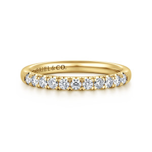 Gabriel & Co. AN16418Y44JJ 14 karat yellow gold Classic wedding band, front view of a straight row of round diamonds held between shared prongs on a smooth band
