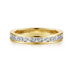Gabriel & Co. AN16448Y43JJ 14 karat yellow gold Art Deco anniversary band, front view of baguette stones between two polished rails, with a maker's mark on the inner wall
