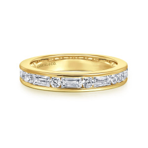 Gabriel & Co. AN16453Y44JJ 14 karat yellow gold Art Deco anniversary band, front view of long rectangular and small round stones taking turns inside a flat channel