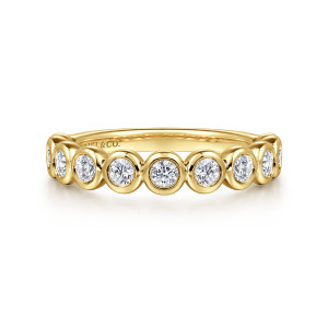 Gabriel & Co. AN16455Y44JJ 14 karat yellow gold Contemporary anniversary band, front view of round diamonds in smooth, touching bezel cups across the top