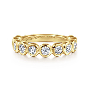 Gabriel & Co. AN16458Y44JJ 14 karat yellow gold Contemporary anniversary band, front view of round diamonds each in a smooth domed bezel across the top of the band